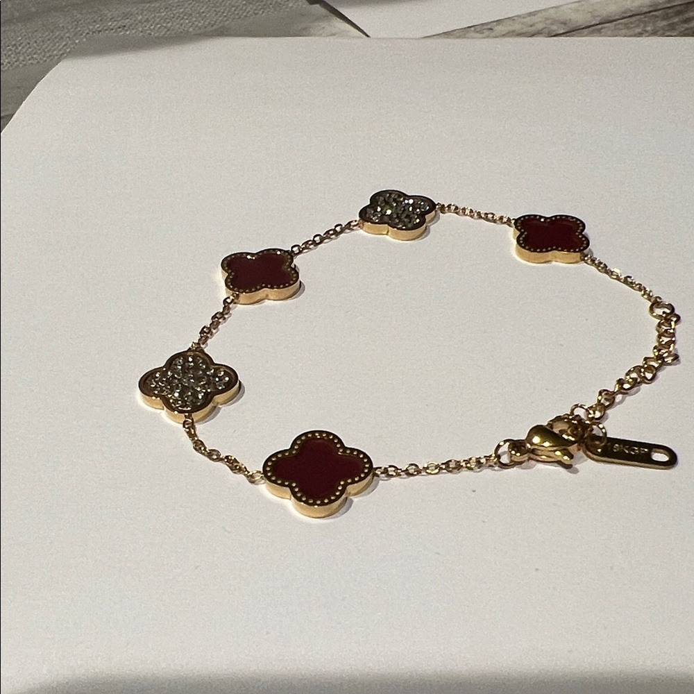 Elegant Gold and Red Clover Bracelet